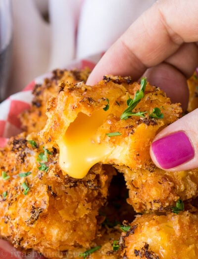 OMG! These Crispy Queso Bites are coated in nacho cheese doritos and then fried to gooey cheesy perfection!