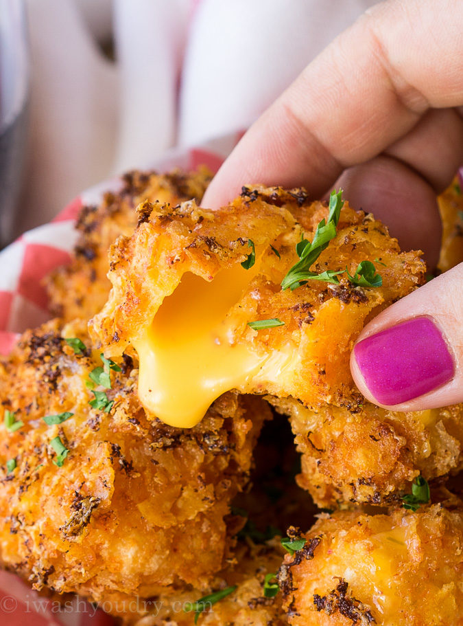 OMG! These Crispy Queso Bites are coated in nacho cheese doritos and then fried to gooey cheesy perfection!