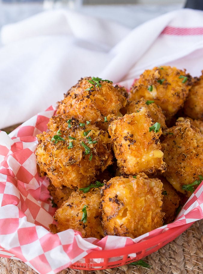 OMG! These Crispy Queso Bites are coated in nacho cheese doritos and then fried to gooey cheesy perfection!