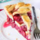 This homemade Raspberry Pie recipe is perfection! The filling is sweet and stays together, doesn't fall apart!