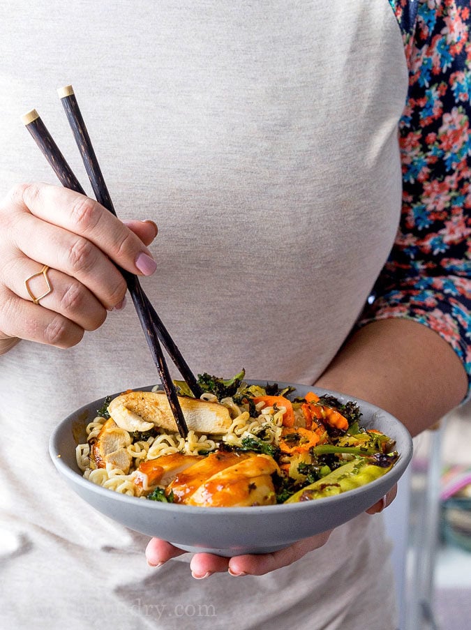 These super quick Roasted Orange Chicken Ramen Bowls are ready in less than 30 minutes! Filled with loads of veggies, plump and tender chicken all over a bed of hot noodles and drizzled with a tasty orange sauce! 