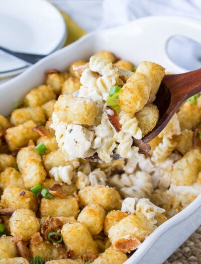 This Ultimate Chicken Bacon Ranch Casserole is filled with creamy pasta and topped with crispy tater tots! This is truly a family favorite where there are never any leftovers!