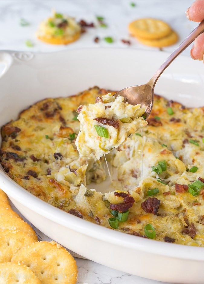 This Cheesy Bacon Artichoke Dip is just 5 ingredients and so easy to make! There are never any leftovers!