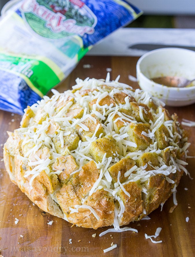 This Cheesy Pesto Crack Bread is a super quick and easy appetizer that everyone will go nuts for!