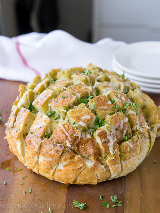 This Cheesy Pesto Crack Bread is a super quick and easy appetizer that everyone will go nuts for!