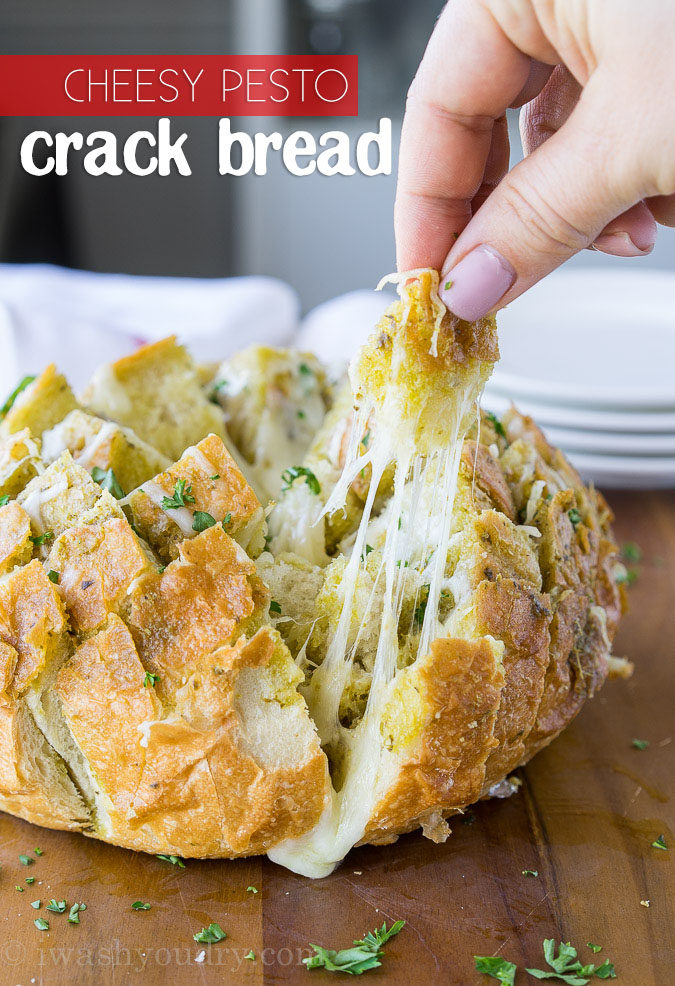 This Cheesy Pesto Crack Bread is a super quick and easy appetizer that everyone will go nuts for!