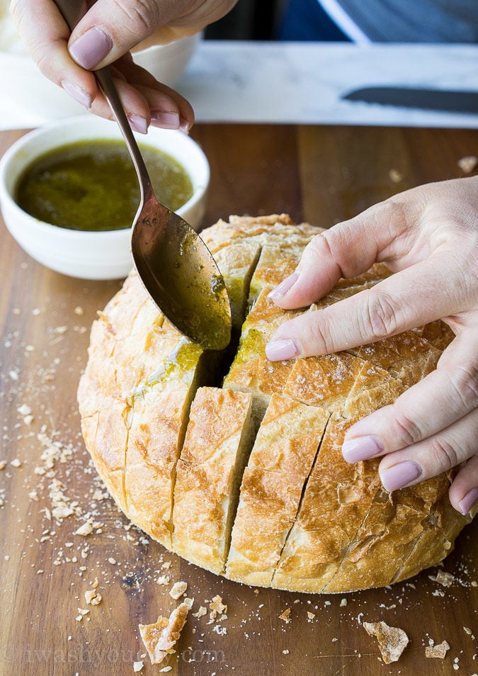 This Cheesy Pesto Crack Bread is a super quick and easy appetizer that everyone will go nuts for!