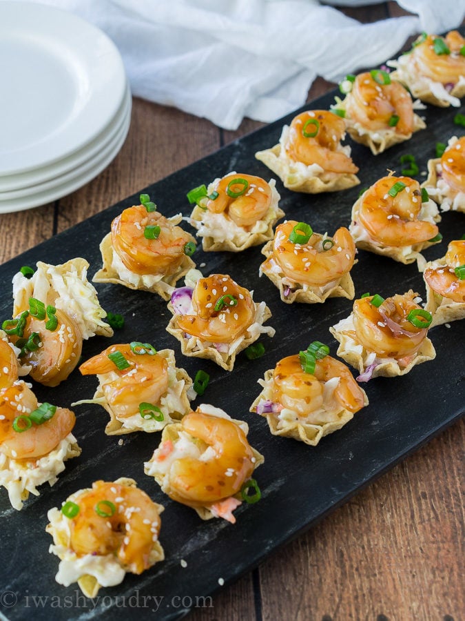 These Teriyaki Shrimp Taco Bites are everything you love about a shrimp taco, but in a pop-able bite-sized form! Saucy coleslaw, tender, sweet teriyaki shrimp and a crunchy tortilla chip scoop! Perfect for appetizers!