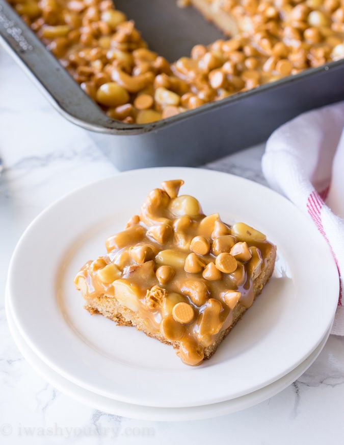 These Gooey Butterscotch Nut Bars are a super quick butterscotch cookie base topped with roasted nuts and gooey caramel. Everyone loves these cookie bars!