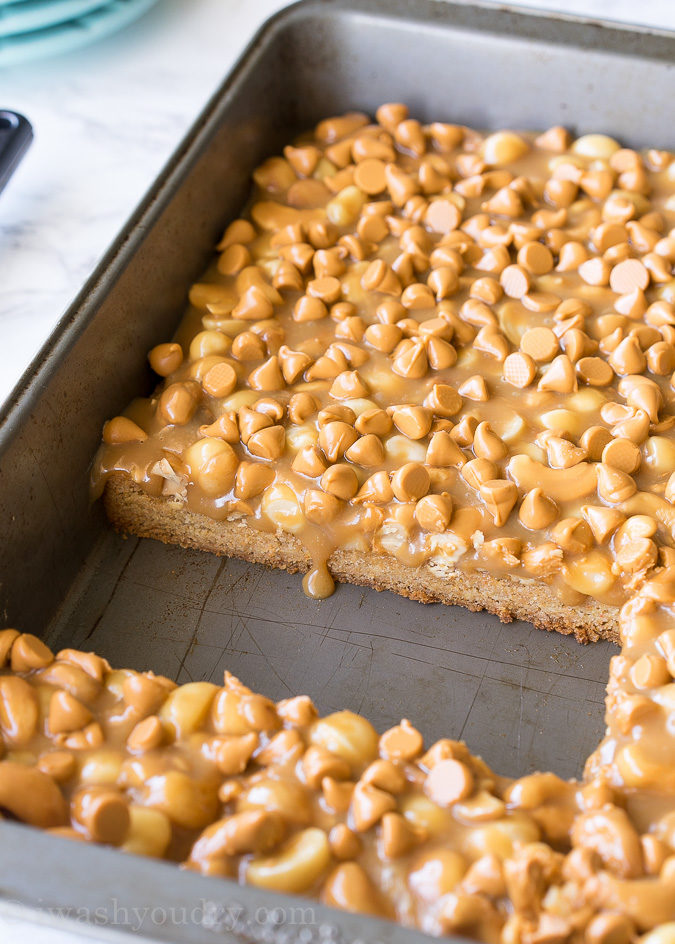 These Gooey Butterscotch Nut Bars are a super quick butterscotch cookie base topped with roasted nuts and gooey caramel. Everyone loves these cookie bars!