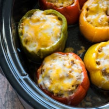 These Slow Cooker Steakhouse Stuffed Peppers are bursting with flavor and only take a few minutes to prep! The perfect easy weeknight dinner recipe!