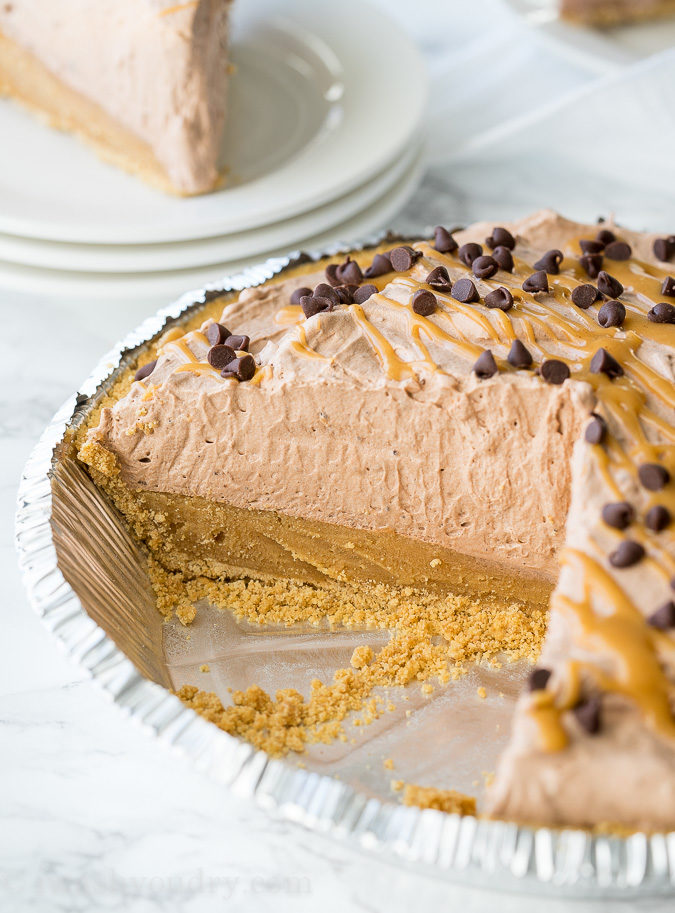 This Peanut Butter Chocolate Mousse Pie is a super simple dessert that comes together in minutes! We love the thick peanut butter ganache on the bottom combined with the light and fluffy chocolate mousse on top! Perfect combination.