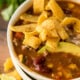 This Quick and Easy Taco Soup recipe is a family favorite! We love topping it with all the taco toppings!