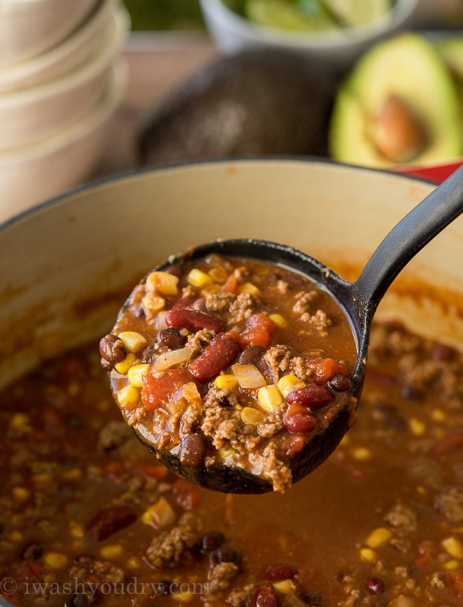 ladle of soup with beans, corn and ground beef