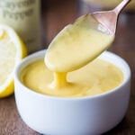 hollandaise sauce in small dish with spoon