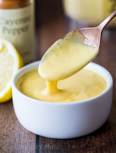 hollandaise sauce in small dish with spoon