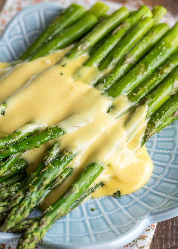 creamy hollandaise sauce on roasted vegetables