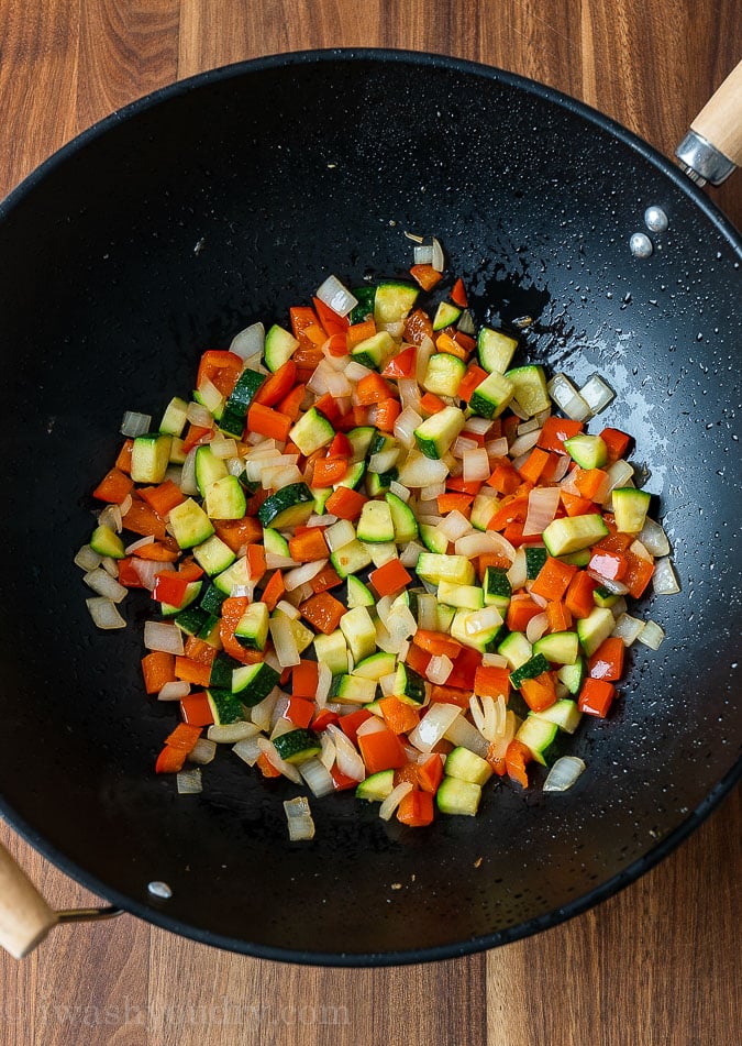 sautéed veggies in black wok