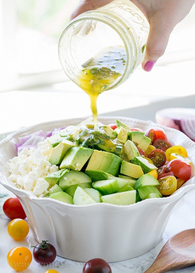 This Cucumber Tomato Avocado Salad is so fresh and delicious! I love the super simple dressing that it's tossed in!