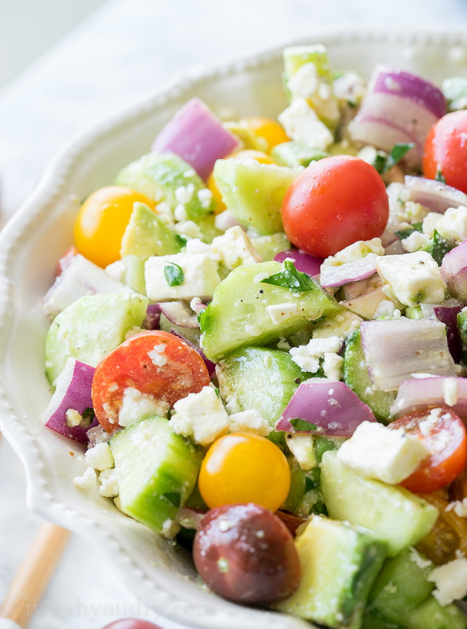 This Cucumber Tomato Avocado Salad is so fresh and delicious! I love the super simple dressing that it's tossed in!