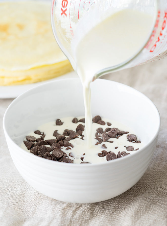 These Boston Cream Pie Crepes are filled with a light and fluffy cream filling and topped with a silky chocolate ganache! My whole family loved this super easy breakfast!