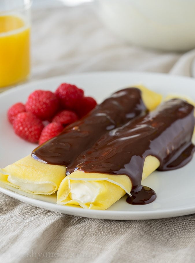 These Boston Cream Pie Crepes are filled with a light and fluffy cream filling and topped with a silky chocolate ganache! My whole family loved this super easy breakfast!