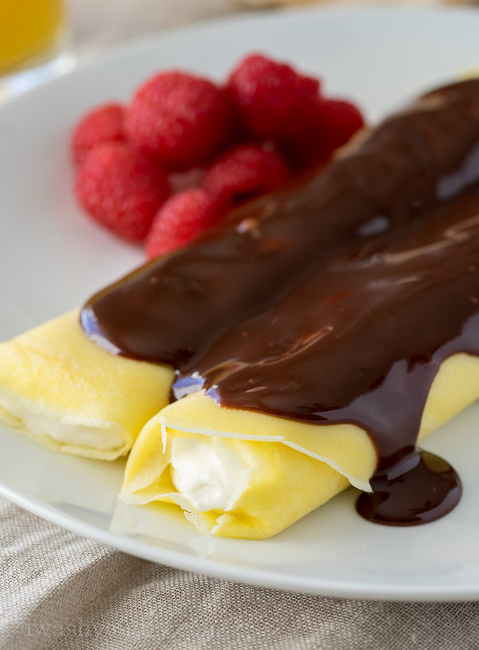 These Boston Cream Pie Crepes are filled with a light and fluffy cream filling and topped with a silky chocolate ganache! My whole family loved this super easy breakfast!