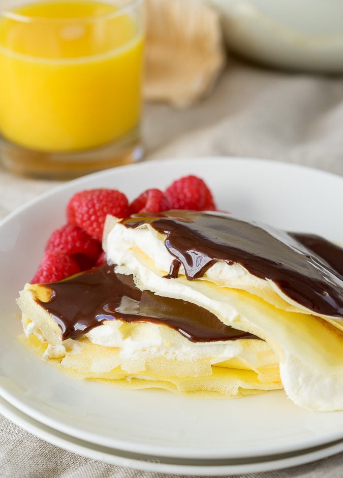 These Boston Cream Pie Crepes are filled with a light and fluffy cream filling and topped with a silky chocolate ganache! My whole family loved this super easy breakfast!