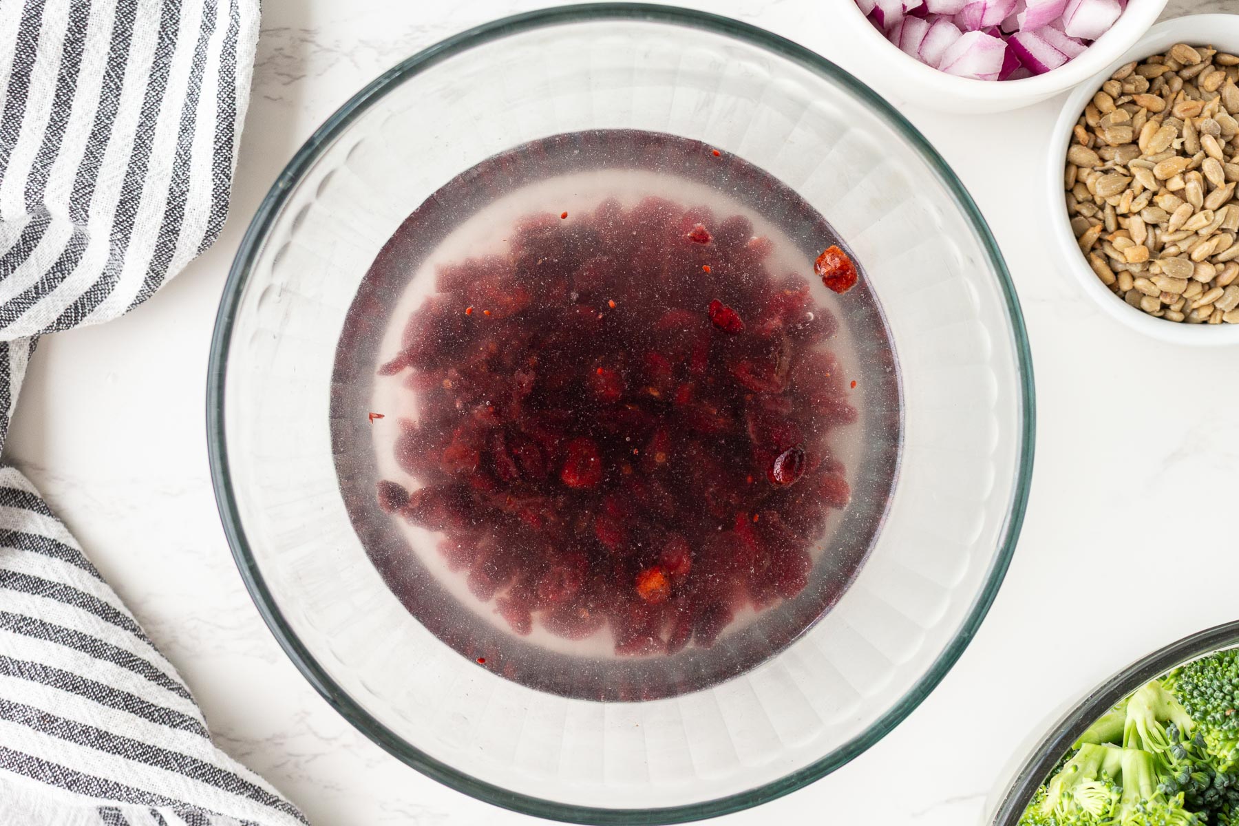 soaking cranberries in water to rehydrate.