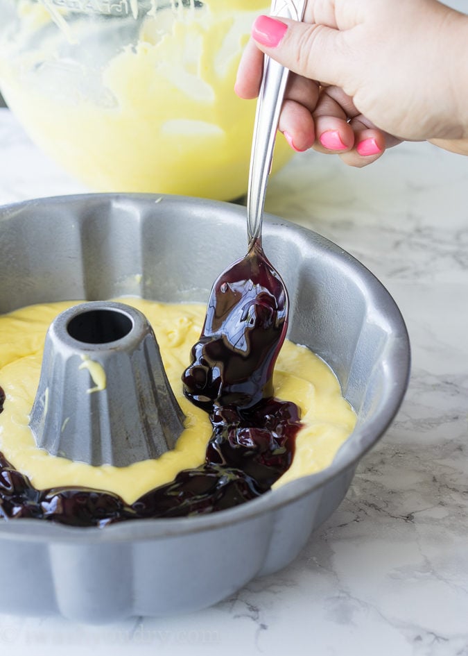 This Lemon Blueberry Surprise Cake is deliciously moist and filled with a surprise blueberry filling! It's so easy to make too!