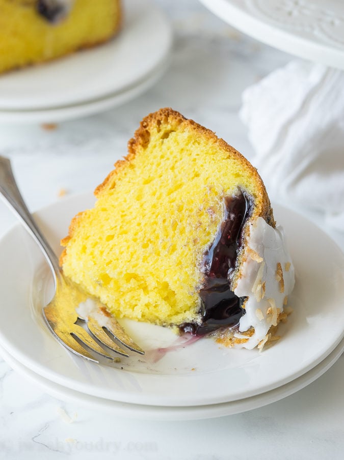 This Lemon Blueberry Surprise Cake is deliciously moist and filled with a surprise blueberry filling! It's so easy to make too!