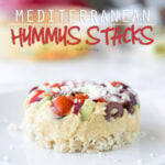 These Mediterranean Hummus Stacks are so much fun! They're filled with a simple Greek salad, classic @Sabra hummus and tender brown rice. We love serving these with a bowl of veggie chips!