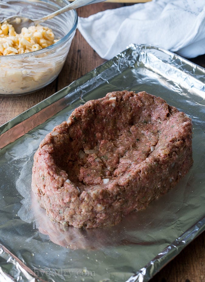 My whole family LOVES this Macaroni and Cheese Stuffed Meatloaf! It's filled with extra cheesy macaroni and the meatloaf is perfectly tender!