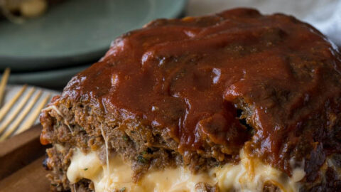 My whole family LOVES this Macaroni and Cheese Stuffed Meatloaf! It's filled with extra cheesy macaroni and the meatloaf is perfectly tender!