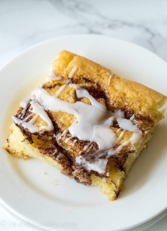 This super easy Cinnamon Roll Sheet Cake is a perfect dessert for potlucks or parties! So easy and seriously so delicious!