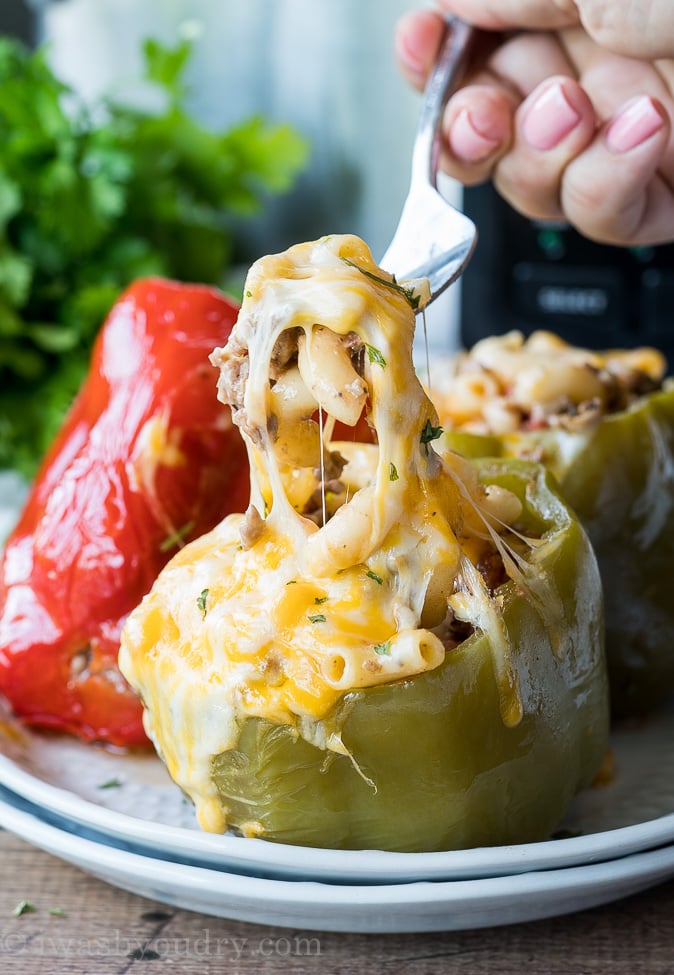 My family loves these easy Slow Cooker Beef and Macaroni Stuffed Peppers for a simple weeknight dinner recipe! It's definitely our kind of comfort food!