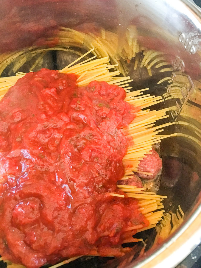 Instant Pot Spaghetti and Meatballs - everyone's favorite comfort food gets a quick and easy makeover with just 3 main ingredients and less than 30 minutes!