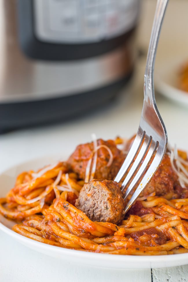 Instant Pot Spaghetti and Meatballs - everyone's favorite comfort food gets a quick and easy makeover with just 3 main ingredients and less than 30 minutes!