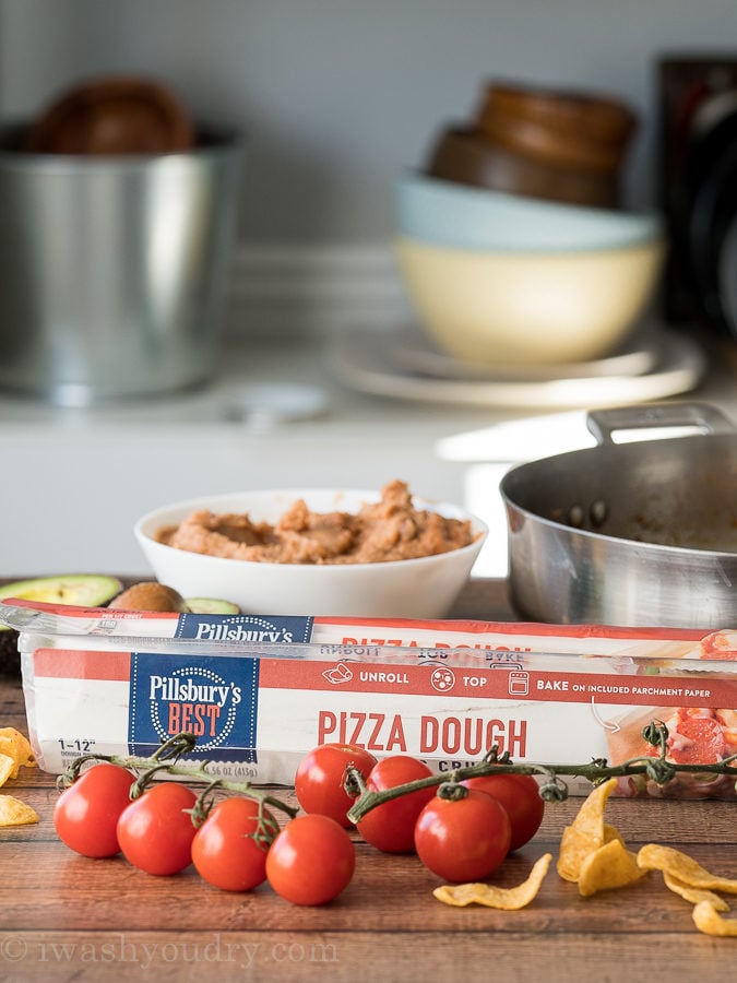Pillsbury's new pizza dough is super fresh and easy to use! It comes on top of parchment paper which makes baking and clean up so much easier!