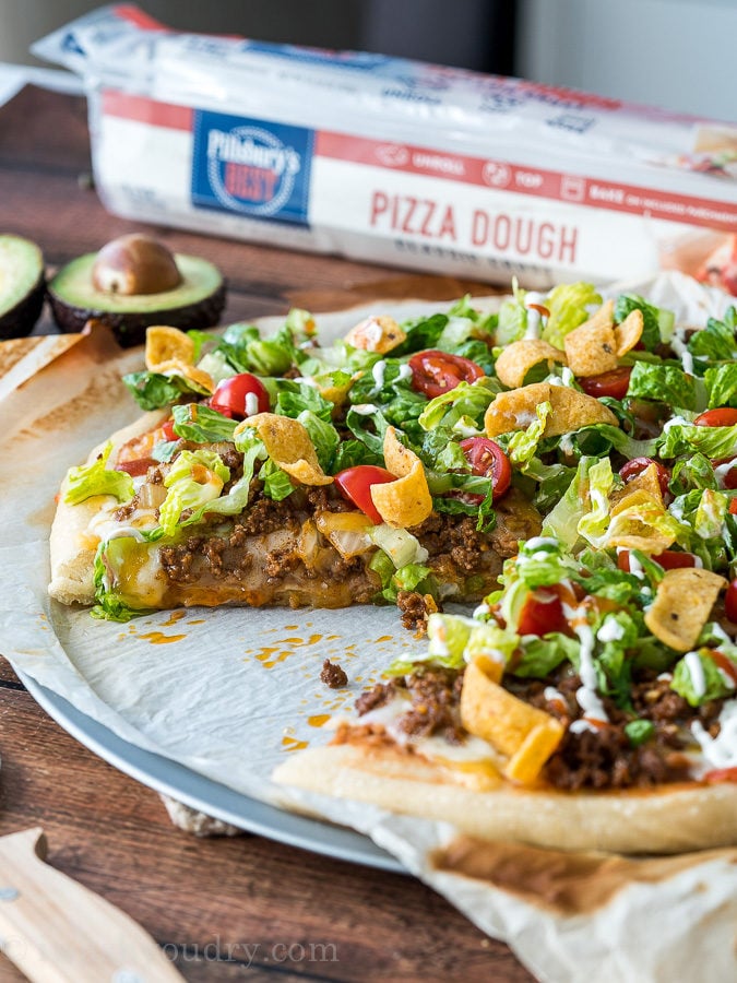 Cheesy Taco Pizza baked in the oven and topped with your favorite taco toppings!