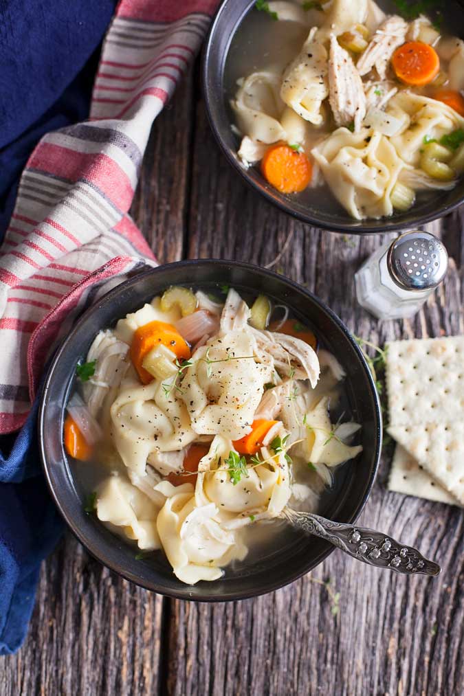 Slow cooker chicken tortellini soup is a hit at our house! Easy to make and hearty for cold, busy nights. 