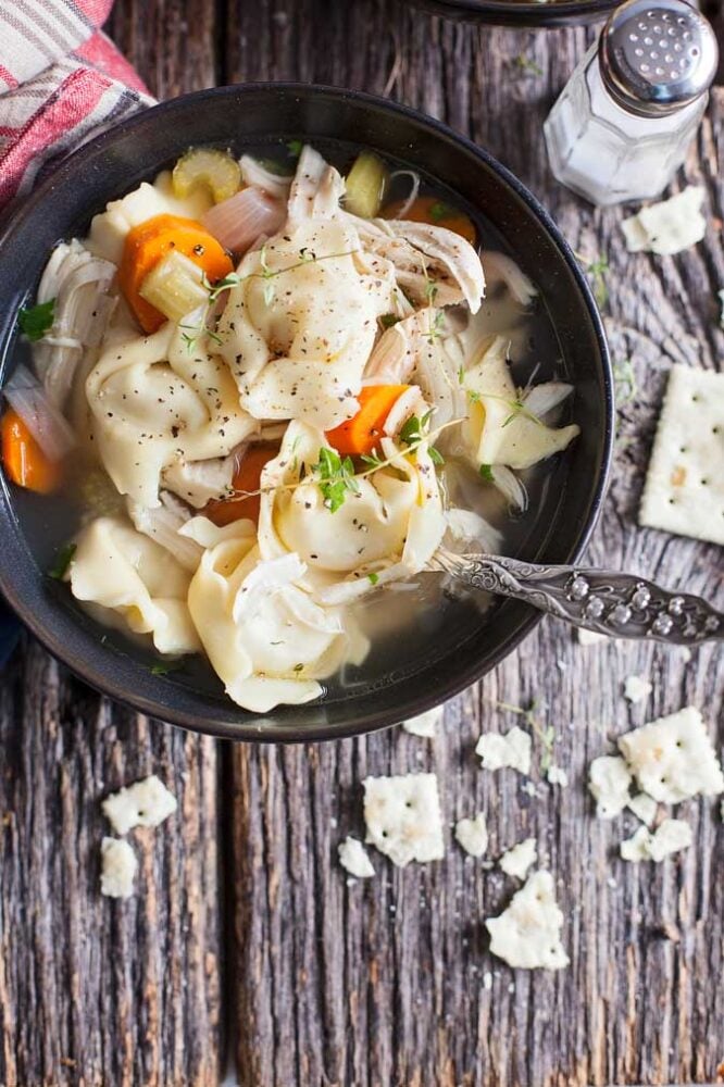 Slow cooker chicken tortellini soup is a hit at our house! Easy to make and hearty for cold, busy nights.