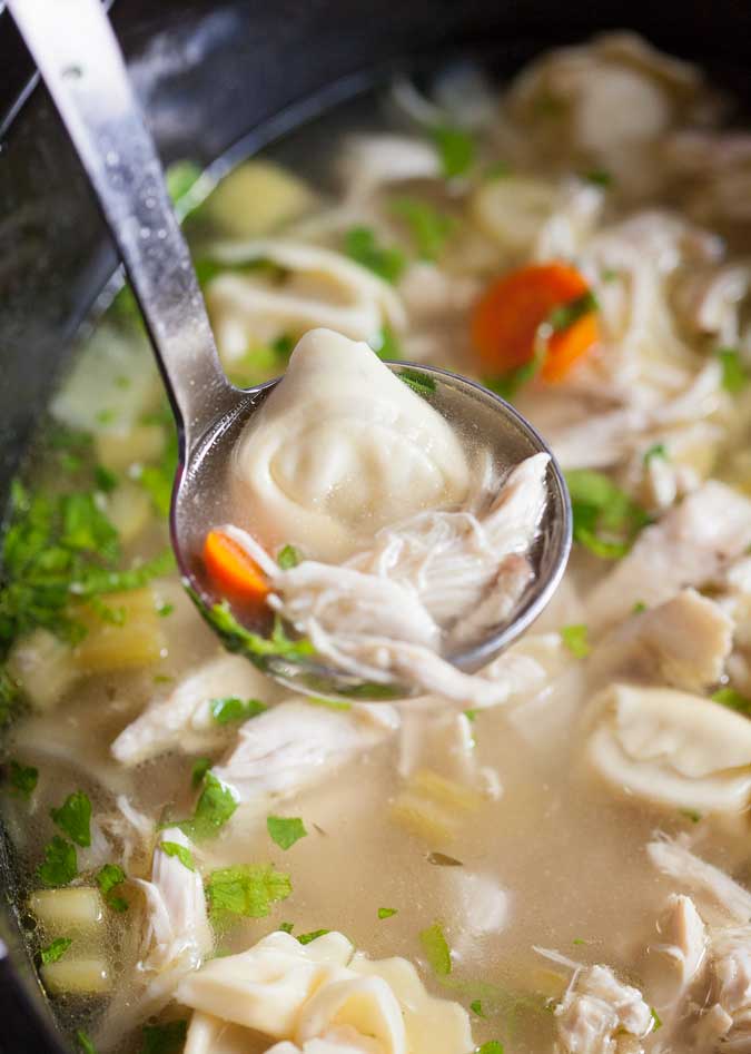 Slow cooker chicken tortellini soup is a hit at our house! Easy to make and hearty for cold, busy nights. 