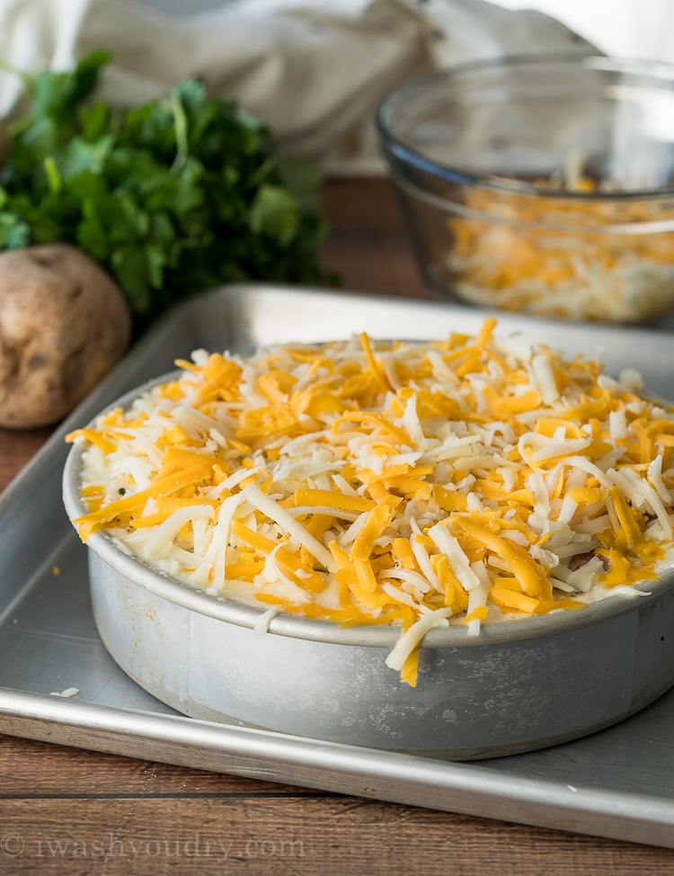 Once the potatoes are cooked in the Instant Pot, remove the pan and place on a baking sheet. Top with cheese and pop under the broiler for a few minutes.