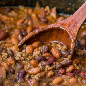 These Slow Cooker Steakhouse Cowboy Baked Beans are a thick and hearty side dish with a punch of savory and sweet spices!
