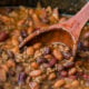 These Slow Cooker Steakhouse Cowboy Baked Beans are a thick and hearty side dish with a punch of savory and sweet spices!