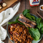 These Slow Cooker Cowboy Beans are simmered all day for a deep intense flavor!