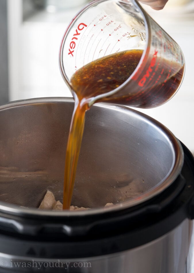 Pour in the sauce for the Instant Pot Orange Chicken and you're almost done!