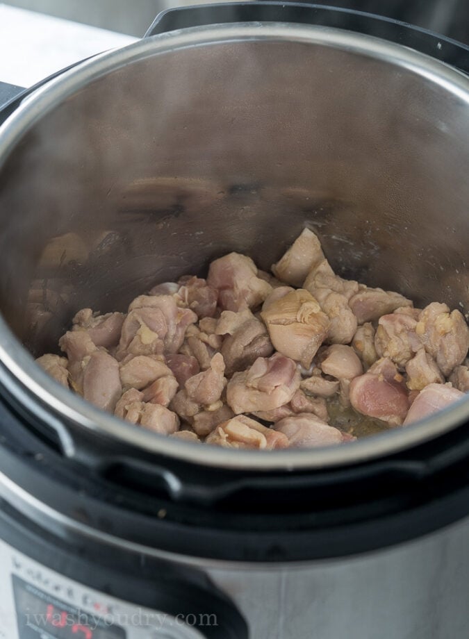 Start by using the saute function of the Instant Pot to brown the chicken thighs. 