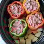 Everything cooks together in this Slow Cooker Meatloaf Stuffed Peppers with Mashed Potatoes! So genius!